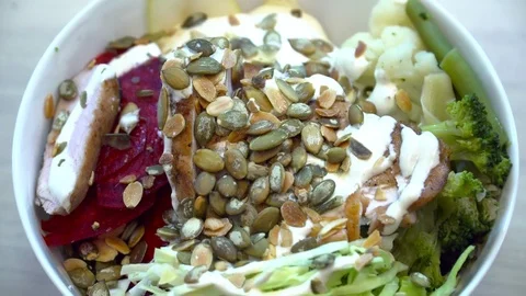 Chef adding seed to the salad Stock Footage 77037078