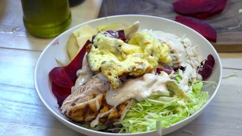 Chef adding seed to the salad slow motion Stock Footage 77038089