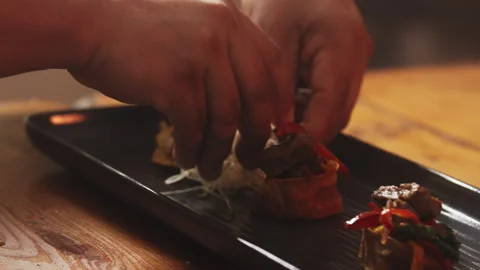 Chef adding sprouts to his dish Stock Footage 274669015