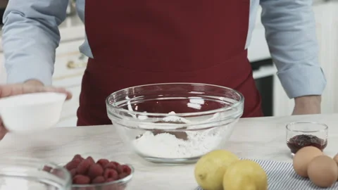 Chef Adding Sugar, Butter and Eggs Ingredients Stock Footage 160977760