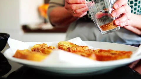 Chef adding sugar to homemade torrijas Stock Footage 261758243