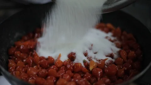 Chef Adding Sugar on a Sauce of Aromatic Red Chili Stock Footage 129333861