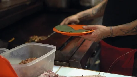 Chef adding taco filling into tortillas Stock-Footage 129395671