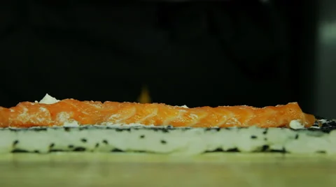 Chef adding tobiko to sushi rolls, close up view Stock Footage 41956436