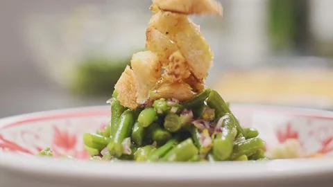 Chef adds bread crumbs on the green bean salad. Stock Footage 153460143
