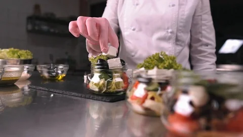 The chef adds cheese to the salad Video stock 124167356