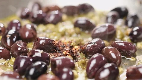 Chef adds chilli flakes in the frying pan. Process of making spaghetti sauce. Stock Footage 154938416