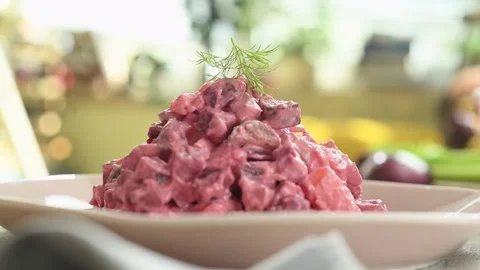 The chef adds dill to the beet and potato salad. Stock Footage 234892052