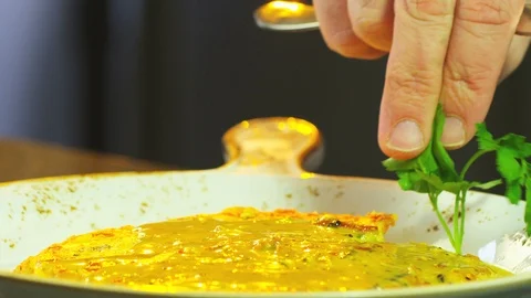 Chef Adds Greens To Dish Stock Footage 125978211