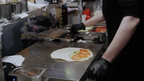 Chef Adds Kelp to Lavash Wrap with Sauce, Greens, and Tomatoes 스톡 동영상 307059214