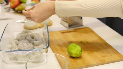 Chef adds lime zest over raw shrimp infusing them with citrusy brightness. Zesty Stock Footage 271044449