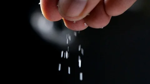 Chef adds salt to the dish, cooking in slow motion Stock-Footage 113596430