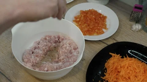 Chef adds salt Preparing Ground Meat Video stock 324528798