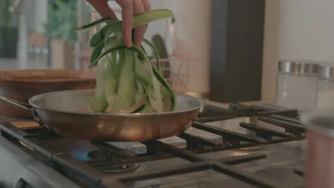 Chef Adds Vegetables to Pan Stock Footage 149631048