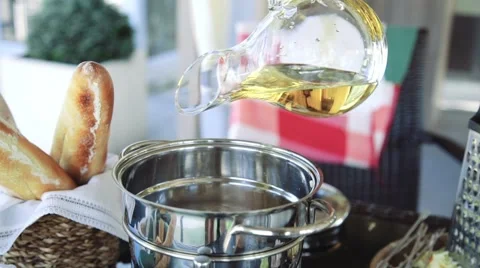 Chef adds white wine to the dish in slow motion Stock Footage 63986549