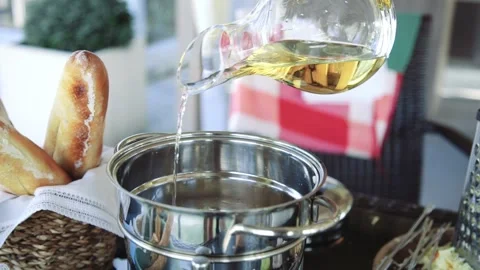 Chef adds white wine to the dish in slow motion Stock Footage 143776808