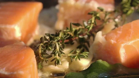 The chef adds wine to the pan with salmon and vegetables Stock Footage 158020213