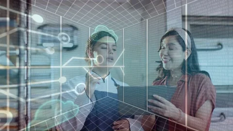 Chef and manager pointing at tablet in kitchen, holo grid and cloud icons Stock Footage 333540193