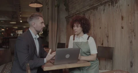 Chef and Restaurant Owner talking with Financial Advisor Investor Stock Footage 221950844