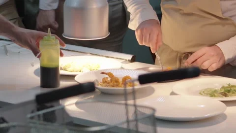 Chef and serious with plate in kitchen at restaurant for fine dining, meal and c Stock Footage 308590384
