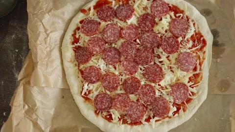 Chef in apron makes pizza with his hands putting the ingredients Stock Footage 280158244