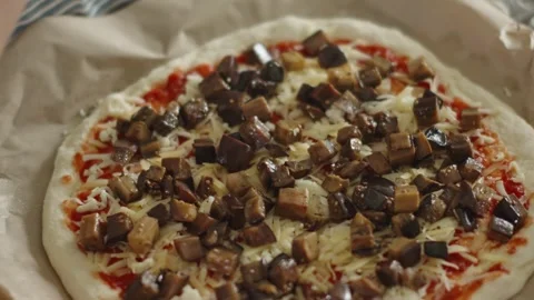 Chef in apron makes pizza with his hands putting the ingredients Stock Footage 280158654