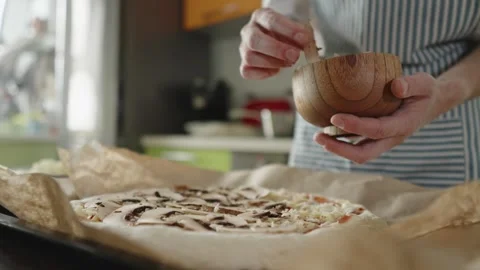 Chef in apron makes pizza with his hands putting the ingredients Stock Footage 280159129