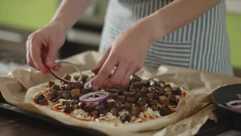 Chef in apron makes pizza with his hands putting the ingredients Stock Footage 280160160