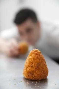 A chef with arancini Stock Photos
