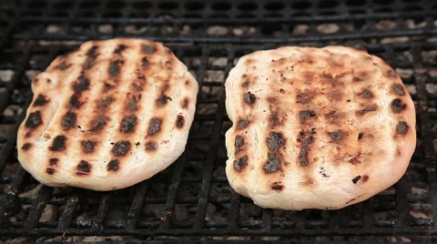Chef arranging bread on barbecue grill Stock Footage 46776055