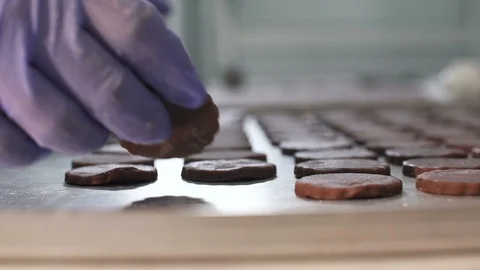 Chef arranging dough to be baked into chocolate cookies at the bakery Stock Footage 121963111