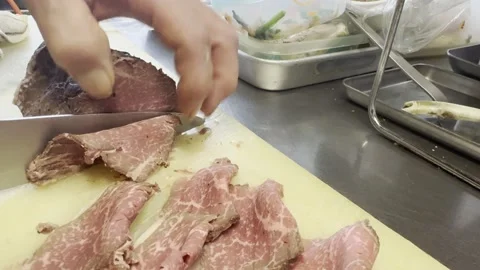 Chef Arranging Slices Of Roast Beef By Hand On A Cutting Board Stock-Footage 338363299