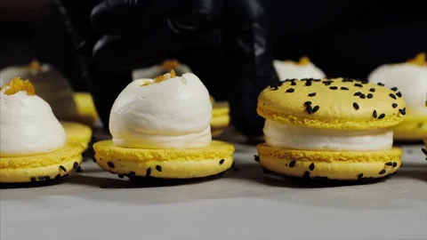 Chef is assembling yellow macarons, close-up. Stock Footage 134518259