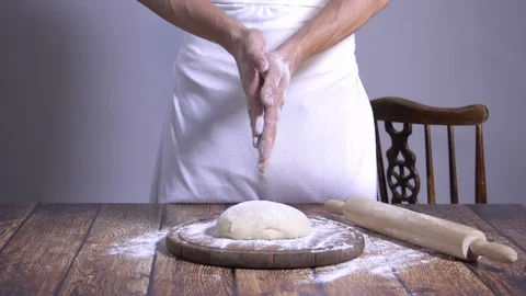Chef. Baker. Sprinkle with flour dough. making pasta, pizza. Video stock 90218566