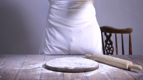 Chef. Baker. Sprinkle with flour dough. making pasta, pizza Video stock 90220283