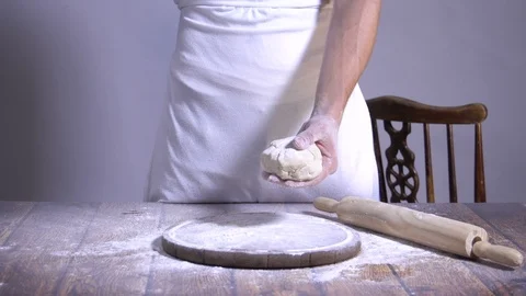 Chef. Baker. Sprinkle with flour dough. making pasta, pizza Stock Footage 90224334