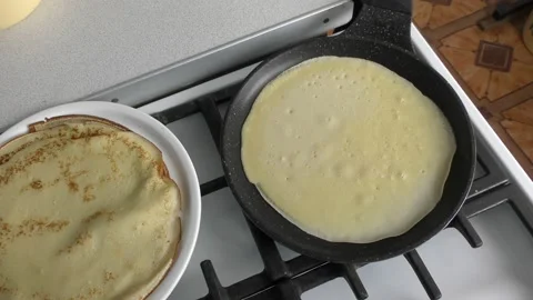 The chef bakes pancakes for breakfast Stock Footage 171984524