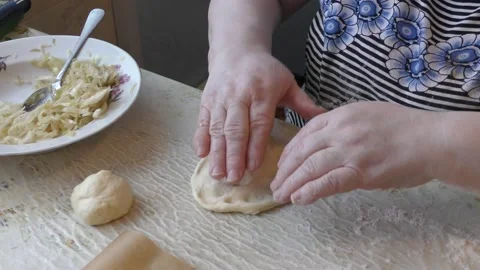 The chef bakes pies with cabbage. healthy food concept 動画素材 143251130