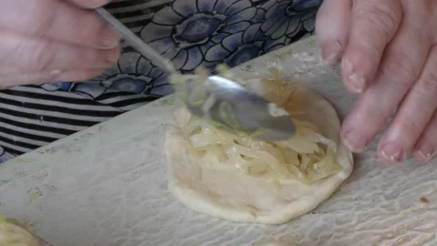 The chef bakes pies with cabbage. healthy food concept 動画素材 143252508