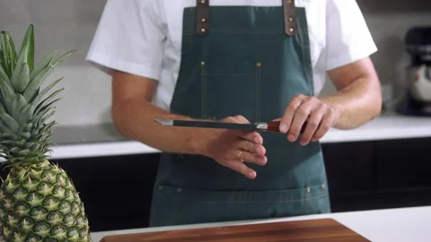 Chef balancing knife slow motion Stock Footage 237886692