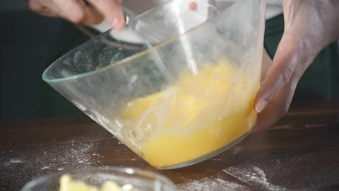 Chef beats eggs to make omelette or dough for pie, cake, pizza in a restaurant. Stock-Footage 124751217