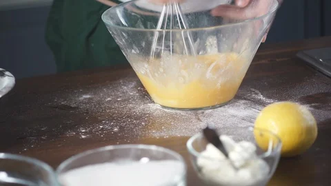 Chef beats eggs to make omelette or dough for pie, cake, pizza in a restaurant. 스톡 동영상 124751340