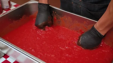 Chef in Black Gloves Mixing Bright Red Tomato Sauce or Food Coloring in Professi Stock Footage 331636398