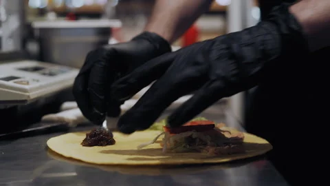 Chef in Black Gloves Prepares Quesadilla by Spreading Sauce Stock-Footage 307088574