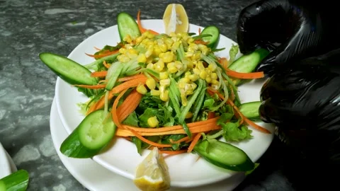 Chef in Black Gloves Preparing Fresh Vegetable Salad with Corn and Carrots Stock Footage 323182980