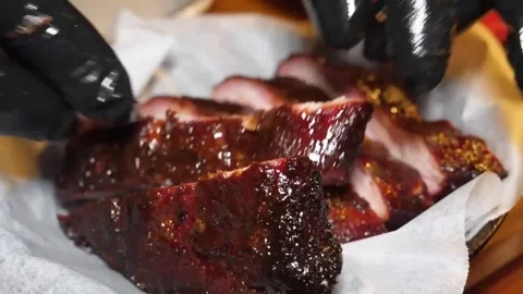 Chef in Black Gloves Serving Juicy Glazed Barbecue Pork Ribs Stock Footage 338212805