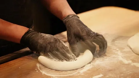 Chef in Black Gloves Stretching Pizza Dough in Restaurant Kitchen Stock Footage 341925082