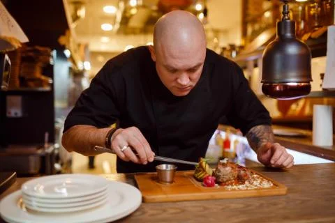 Chef in a black uniform jacket Stock-Fotos