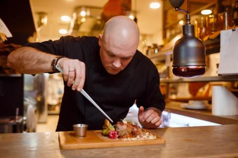 Chef in a black uniform jacket Foto stock