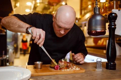Chef in a black uniform jacket Foto stock